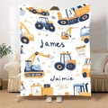 Custom flannel blanket showing bright cartoon construction trucks with name personalization - 100x150cm