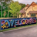 3D floral Welcome banner with colorful paper-style flowers on deep blue outdoor background - Welcome Floral (HF1001-12) / 200x40cm