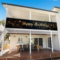 Elegant black and gold Happy Birthday banner displayed on a white balcony railing - 200x40cm / Black Gold Happy Birthday