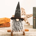 Halloween faceless gnome doll with black cat hat and grey faux fur beard on wood bench - Black Cat Gnome