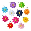 Detail view of eleven colorful embroidered daisy flower patches for DIY clothing decoration - Multicolor Small Flower Collection