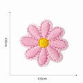 Detail view of 4cm pink daisy embroidery patch with size markers on white background - Pink Yellow Core Daisy
