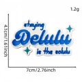 Blue 'Staying Delulu' embroidered patch with cyan stars on white twill fabric base - Positive Energy English Cloth Patch #6