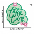 Aufbügler in Minzgrün mit Take Care Schriftzug und kleinen rosa Blumen Stickerei - take care (Englischer Aufnäher 3#)