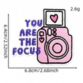 Pink camera embroidery patch with purple You Are The Focus text and heart detail - YOU ARE THE FOCUS Camera Style