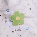 Detail of 6.6cm green flower embroidery patch with yellow core and white stitched edge - 2# / Light Green
