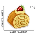 Close-up of strawberry swiss roll embroidered patch with dimensions 5.8cm and 2.1g weight - Strawberry Cake Roll