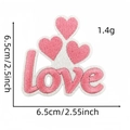 Detail showing pink embroidered love heart patch with 6.5cm dimensions and fine needlework - Style 7