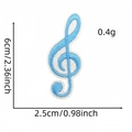 Detailed blue musical note treble clef embroidery patch with size measurements - Blue G-clef