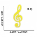 Detailed view of yellow treble clef music note embroidery patch with 6cm size dimensions - Yellow Treble Clef
