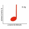 Macro detail of red musical note embroidery patch with dimensions 6.1cm by 2.4cm - Red Quarter Note