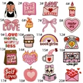 Macro view of 20 assorted pink heart and coffee embroidered iron-on patches with precise edges - Full Collection Set