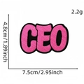 Pink CEO letter embroidered patch with black border measuring 7.5cm by 4.8cm - Peach Pink Letters (CEO)