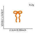 Orange bow embroidered patch for DIY clothing repair with size measurement details - Bow Patch 10#