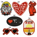 Detail view showing six red heart embroidery patches with intricate stitching patterns - Complete Pattern Collection