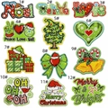 Close-up of Christmas embroidery patches including Santa hats and trees on white backdrop - Full Collection Assorted Styles