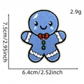 Blue gingerbread man embroidery patch with white wave border and red bowtie detail - Blue Gingerbread Man