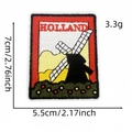 Embroidered Holland souvenir patch featuring a black windmill and red floral landscape - Holland Windmill Style (标志布贴17#)