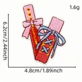 Pink ballet shoes embroidered patch with red ribbon and heart detail for DIY decor - Lip Glaze Collage