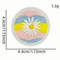 Embroidered daisy flower patch with pink blue yellow stripes measuring 4.4cm diameter - Flower Patch Style 13