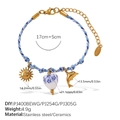 Blue braided bracelet with gold sun, dolphin and ceramic heart charms in marine theme - Sun Ceramic Heart Dolphin Style (SL385BEG8)