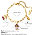 Gouden roestvrijstalen armband met spook- en kersenhangers en een karabijnsluiting - Spook Kers Bedel Stijl (SL395G1)