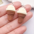 Close-up of resin ice cream pendants with waffle cone texture and silver metal rings - Creamy Yellow (28x15x15mm)