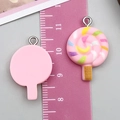 Pink 3D resin lollipop charms for DIY jewelry making with colorful swirl details - Pink Lollipop