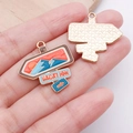 Golden alloy charm pendant with vacation mountain design and non-slip texture back - Signpost (Vacation) - Blue