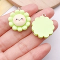 Light green resin sunflower DIY charm with cute smiley face and metal loop accessory - Green Sunflower Smiley (24780)