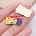 Handheld view of alloy boarding pass charm with red and blue enamel for DIY crafts - Boarding Pass - Yellow