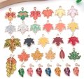 Detailed view of colorful enamel autumn leaf charms with maple and oak designs for jewelry - Assorted Thanksgiving Plant Leaf Styles (SN1621)