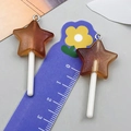 Vue détaillée de sucettes étoiles en résine pailletée avec échelle de mesure DIY - Sucette Étoile Résine Transparent Brun (24181)