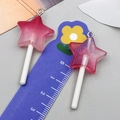 Vue détaillée de breloques sucettes en résine pailletée en forme d'étoile avec dégradé - Sucette Étoile Résine Transparent Rose (24182)