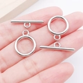 Polished silver OT toggle clasps for jewelry making held in hand for scale detail - 18x23mm / Silver Smooth Circle Toggle Clasp