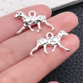 Detail view of two silver dalmatian dog charms with textured finish for jewelry making - Bright Silver Dalmatian Walking 13x23mm (20540)
