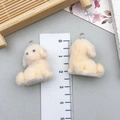 Detail showing two beige flocked poodle pendants with metal rings for DIY crafts - Turn Head Puppy Style (23134) / Single Piece / Light Yellowish Brown