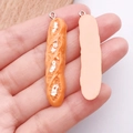 Realistische hars stokbrood hanger met zilveren ring voor DIY ketting accessoires - Stokbrood (24641) / 1 Stuk (48x10x5mm) / Geel