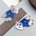 Detail shot of acrylic cartoon puppy pendant with ruler for 4cm size measurement - White Double Sided Printed Bichon Frise (24025)