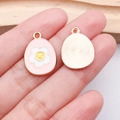 Pink enamel Easter egg pendant with white flower and yellow smiley face for DIY jewelry - Pink Frangipani Egg (25127)