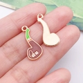 Enameled eighth note musical charm pendant with green and brown decorative floral inlay - Brown Irish Pipe (25089)