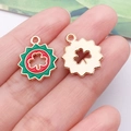 Green enamel clover and gold metal charms for DIY jewelry making on model's hand - Red Irish Sun Shamrock (25106)