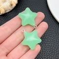 Detailed macro view of mint green resin star pendants with silver metal rings - Green Luminous Star (24060)