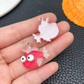 Detail showing two cartoon resin fish charms with big eyes and silver metal rings - Red Little Fish Style (24653)