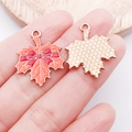 DIY maple leaf charm with orange enamel and red bow on a golden alloy metal base - Orange Enamel Bow Maple Leaf (25234)