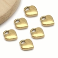 Macro view of six gold-plated stainless steel 3D heart charms for DIY jewelry making - Medium Heart (T2279) / 11x13x3.5mm