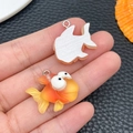 Detailed front and back view of a resin tropical fish pendant for DIY jewelry making - Orange Big Eyed Goldfish (24662)
