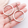 Polished silver metal keychain rings with flat chain links displayed on hand - White K with Chain Style (18768)