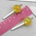 Paire de breloques sucettes jaunes en résine pailletée avec crochets et bâtonnets - Sucette Résine Transparent Jaune (24174)