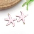 Close-up of pink starfish enamel charms with white polka dots for DIY jewelry making - Medium Pink Polka Dot Style (T1237)
